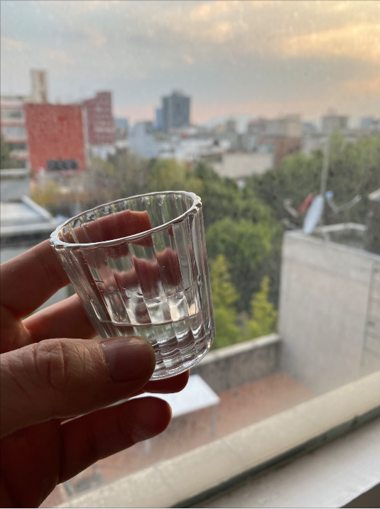 taking a sip of mezcal in London with the Vaso Veladora - Set of 2 mezcal glasses, available at Sin Gusano