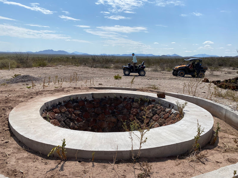 A large in ground outside oven for the cooking of mezcal