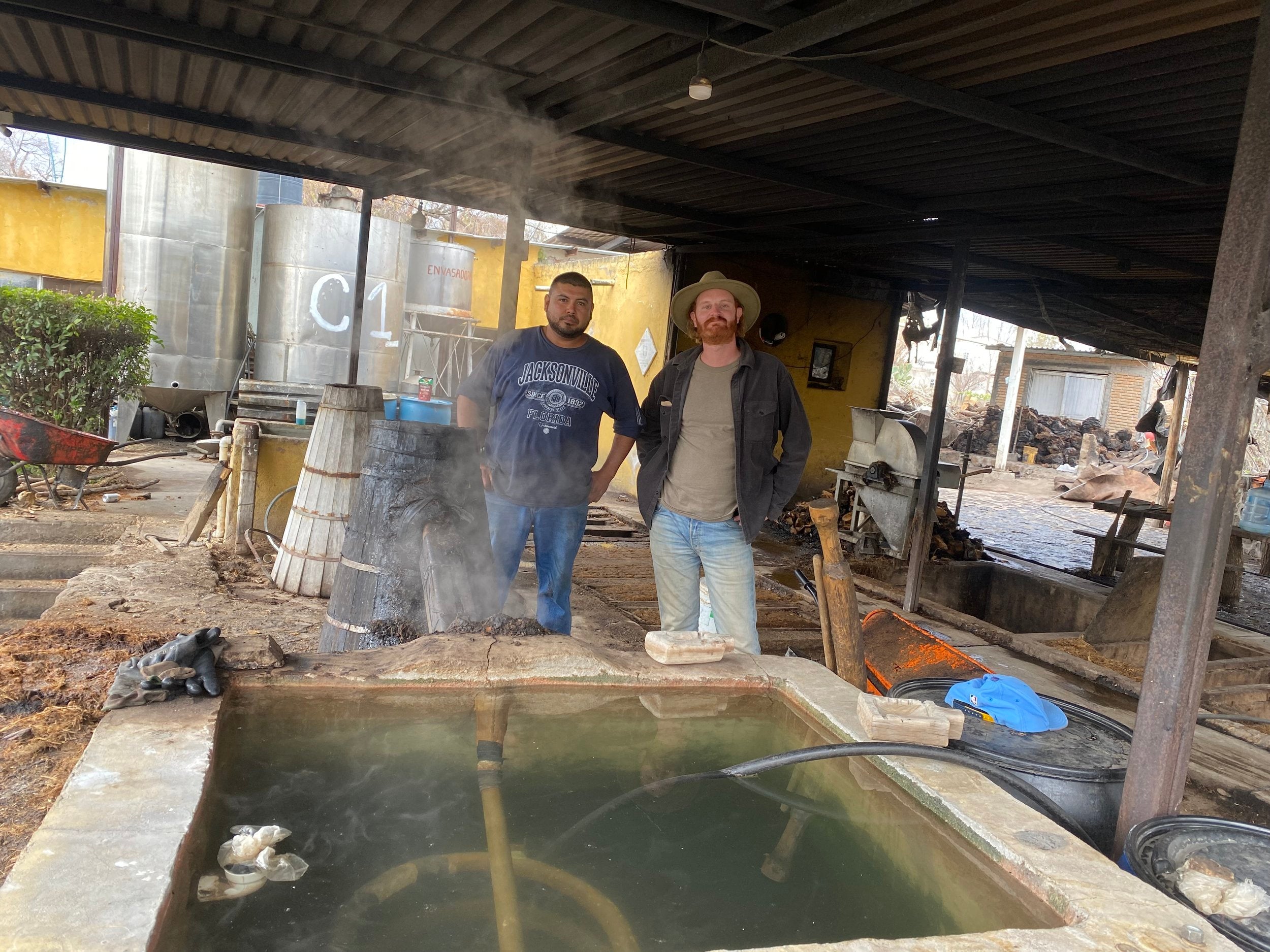 Manuel & Jon at the still waiting for the mezcal to be made