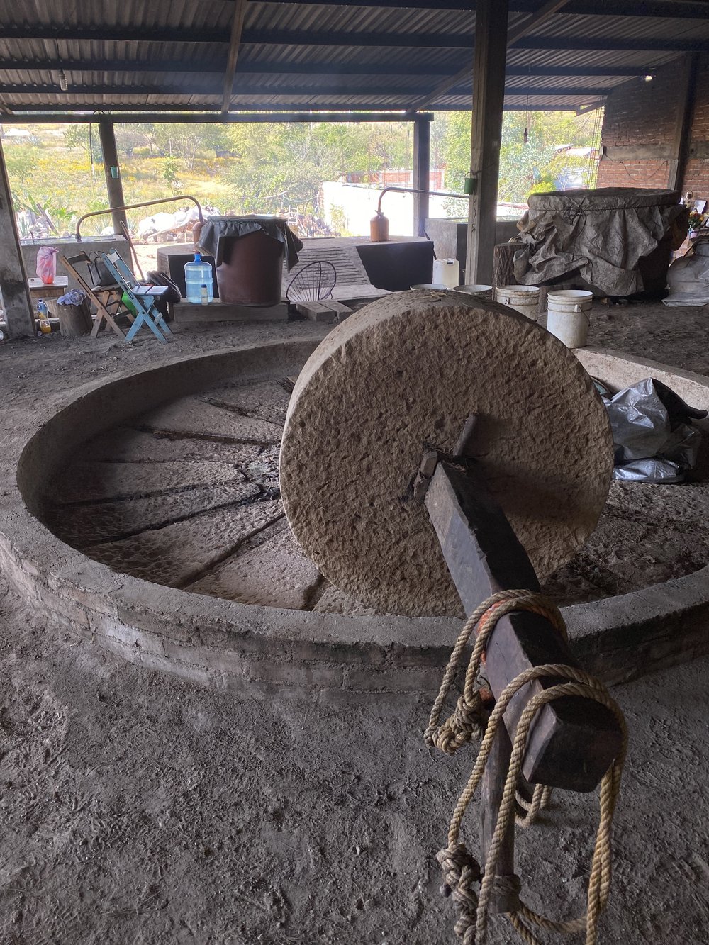 a stone tahona used for milling mezcal