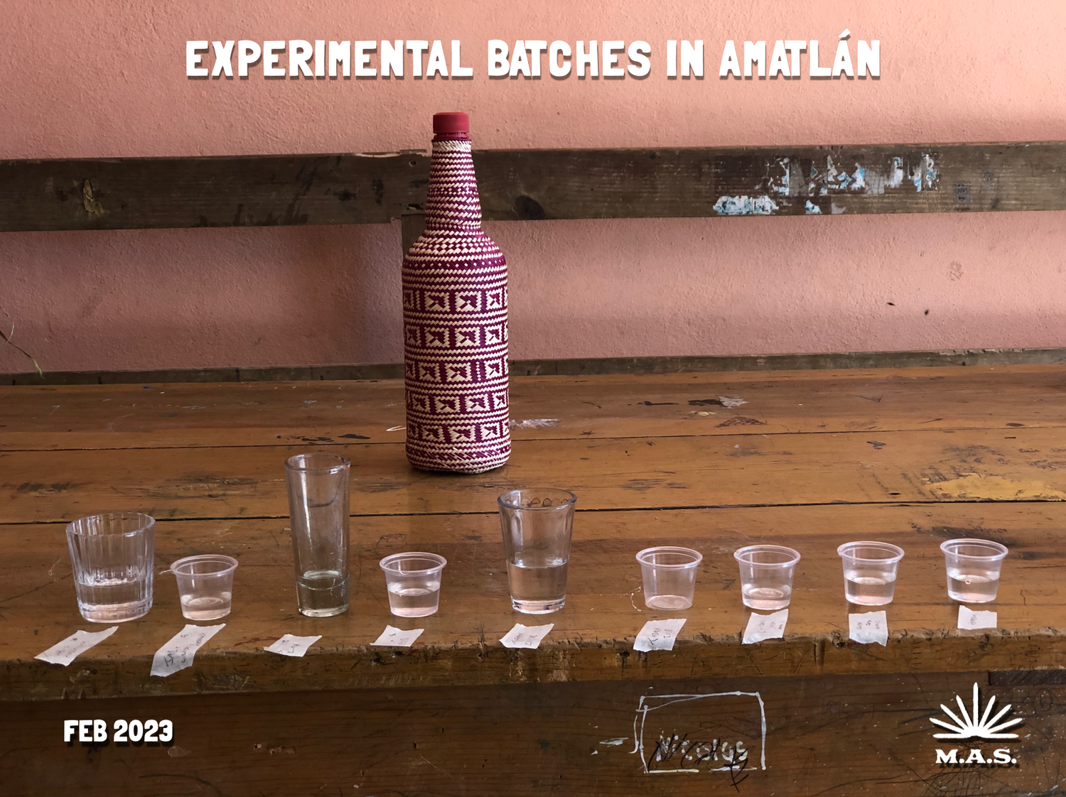 A bottle of mezcal with tasting glasses