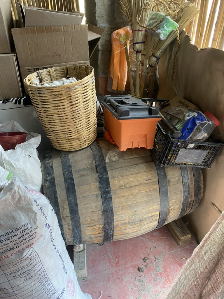 The barrel holding forgotten mezcal quietly aging surrounded by clutter