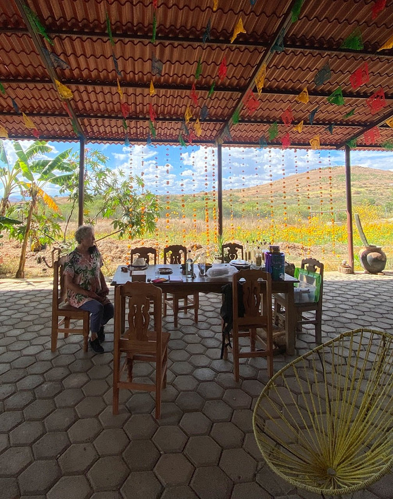 A woman sat at a table waiting for a mezcal tasting to begin